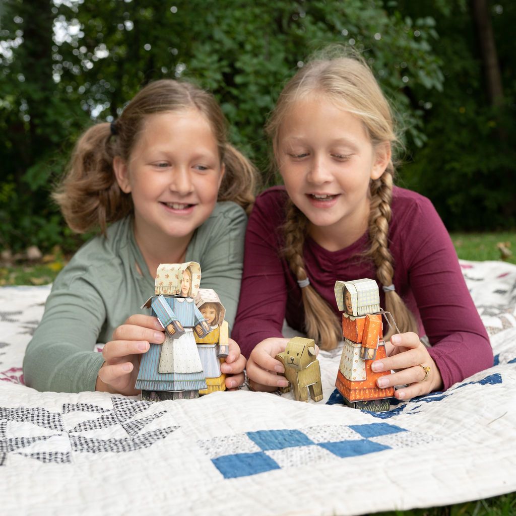 CUBLES Little House on the Prairie Set featuring poseable characters Mary, Carrie, and Jack, crafted from eco-friendly paperboard.